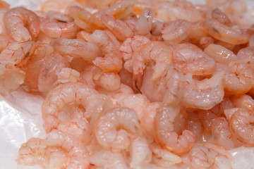 raw shrimps on ice