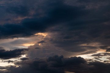 twilight sunset sky with cloudy and sunlight through clouds