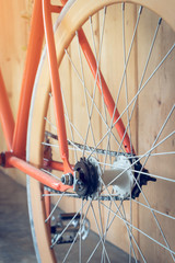 fixed gear bicycle parked with wood wall, close up image