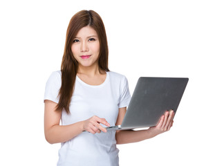 Young Woman use of the notebook computer
