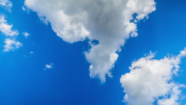 Clouds moving over the blue sky Time lapse
