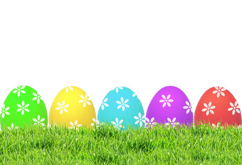 Easter eggs on green grass isolated on white