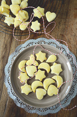 Traditional swiss cookies for christmas time Mailanderli on plate dark background top view 
