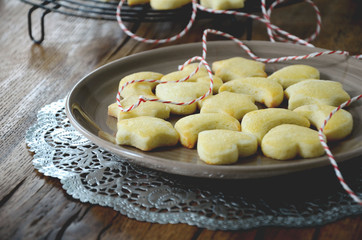 Traditional swiss cookies for christmas time Mailanderli on plate dark background