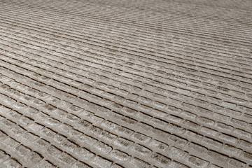 Old wall/pavement made of different bricks