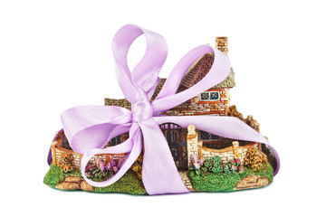 Toy house with bow as gift