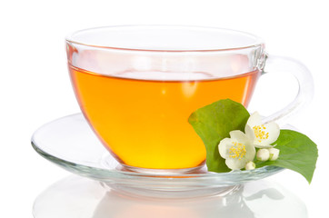 Glass cup of tea with jasmine on the white background