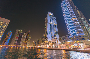 Fototapeta premium Street view of Dubai Marina skyscrapers at night