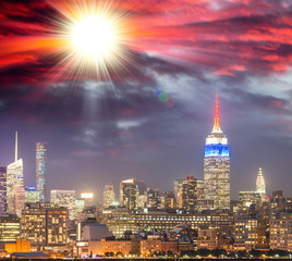 Fototapeta na wymiar Stunning sunset over Midtown Manhattan. View from Jersey City