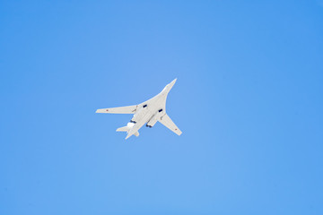 Tupolev Tu-160M (Blackjack) supersonic, variable-sweep wing heavy strategic bomber flies against blue sky background