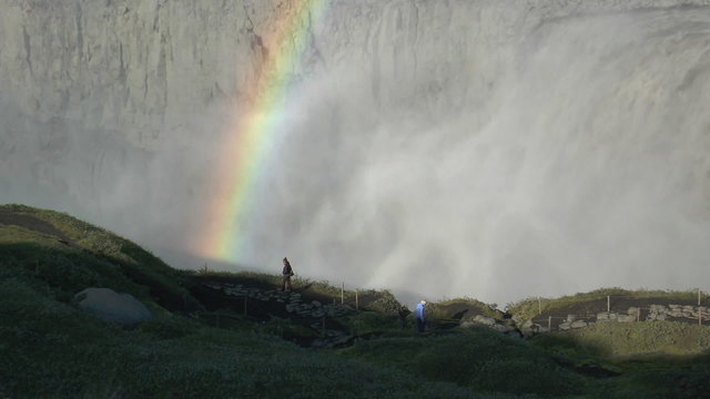 rainbow above detifoss waterfall in iceland closeup