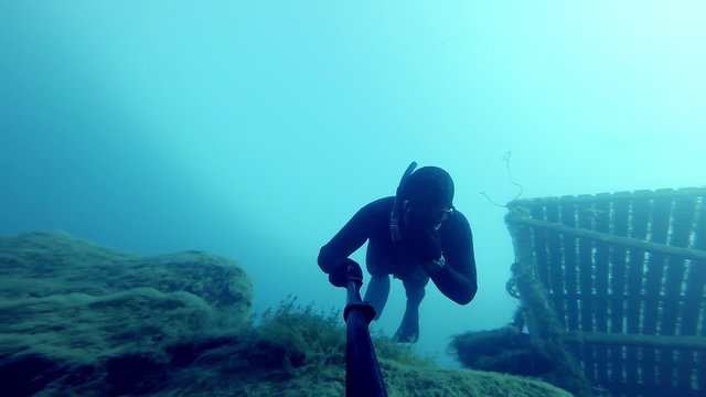 Freediver Freefalling into a Deep Cliff (20m) Underwater