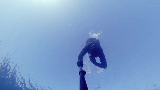 Freediver Diving at 20m Deep and Equalizing.