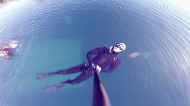 Very Calm Freediver doing a Breath-up Before Diving. Water Dripping Making Beaufull Abstract Effects