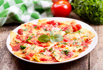 plate of ravioli with tomato sauce