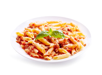 plate of penne pasta bolognese on white background