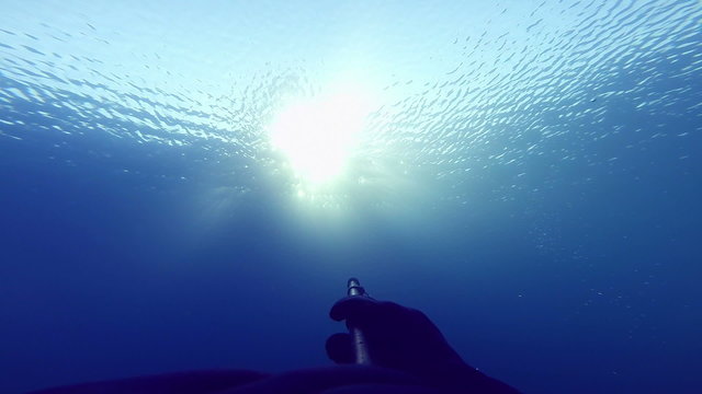 Freediver Showing the Amazing Rays of Sunlight from Underwater