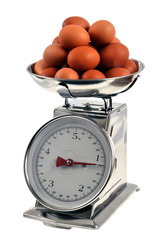    Des &oelig;ufs de poule sur une balance