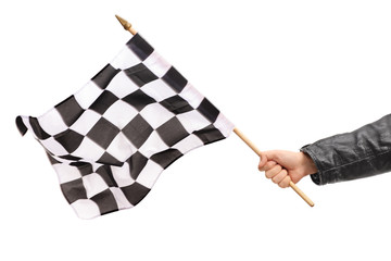 Hand waving a checkered race flag