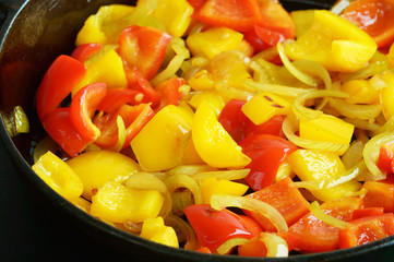 Onion and paprika in pan