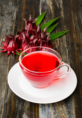 Fresh roselle juice (healthy drink) on wooden background