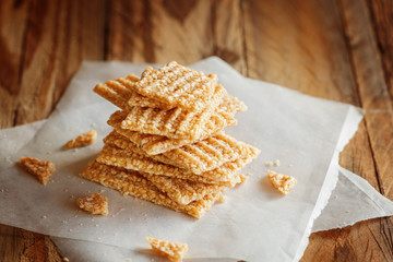 Chopped Candied  White Sesame Seeds in Stack on Wooden Background