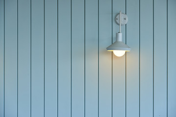 wooden wall with white lamp
