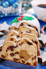sliced christmas stollen cake on blue plate