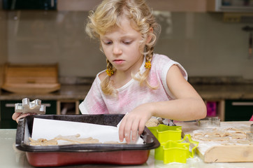 child helping in kitchen