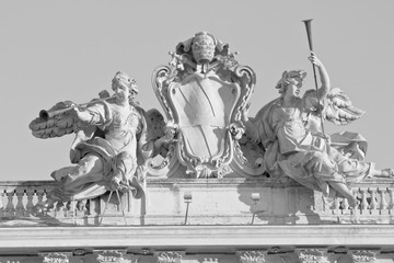 Fototapeta premium Close up detail of the statue on the top of Palazzo della Consulta in Rome, Italy. Black and white edited