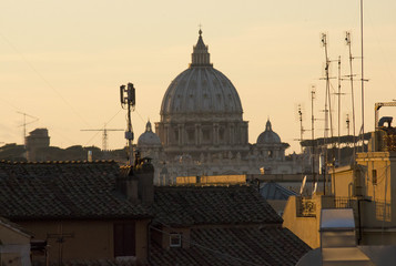 View of Saint Peter Dome from Quirinal Square in Rome at sunset time