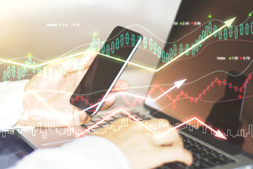 Double explosure with business chart and businessman with smartp