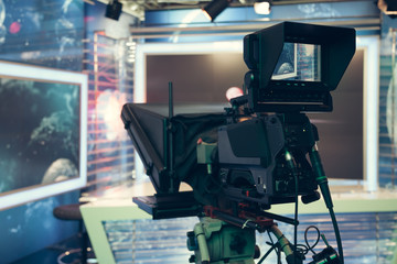 Television studio with camera and lights - recording TV NEWS