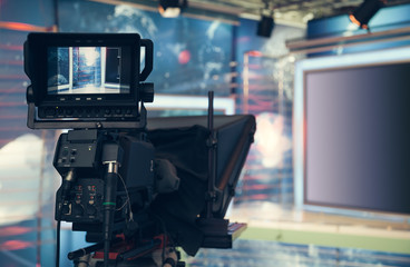 Television studio with camera and lights - recording TV NEWS