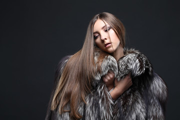 Portrait of a seductive lady in fur coat 