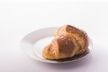 buttery croissants on a white background