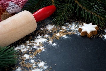 black background for text with a rolling pin and gingerbread