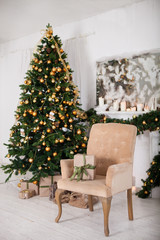 Christmas gift on the background of the Christmas tree near a fi