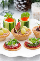 Set of festive Christmas mini appetizers, vertical, closeup