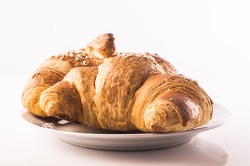 buttery croissants on a white background