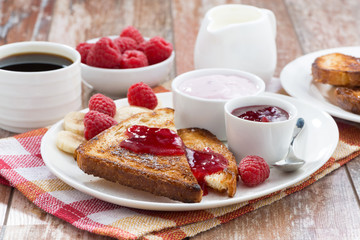 sweet toasts with fresh raspberry, jam and yoghurt