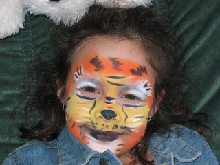 Painted girl gazing happy