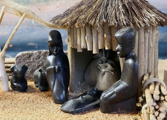 african nativity scene with baby jesus and family in a hut on Ch