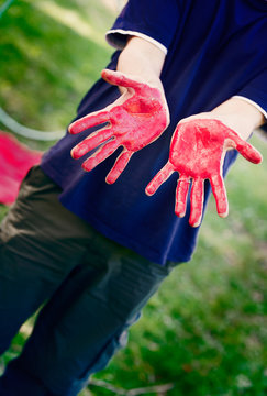 Man With Hands Painted With Red Body Paint