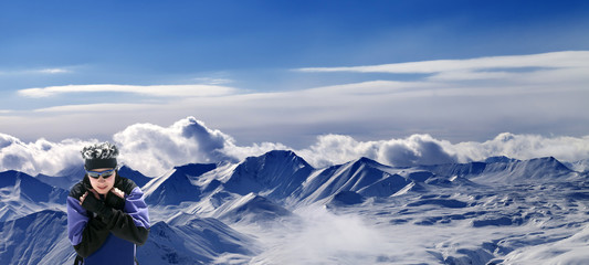 Fototapeta na wymiar Snowboarder and panoramic view on snowy plateau
