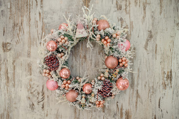 christmas wreath with pink decor and bubbles