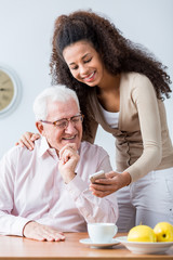 Grandfather and adult granddaughter