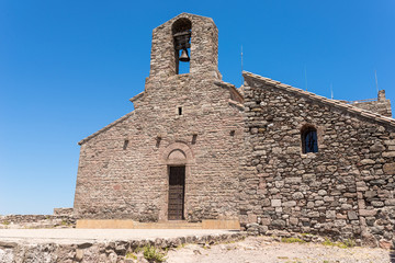 Fototapeta na wymiar Monastery of Sant Llorenç del Munt, situated on top of La Mola, the summit of the rocky mountain massif. The original monastery built in the mid-11th century is Catalan Romanesque style