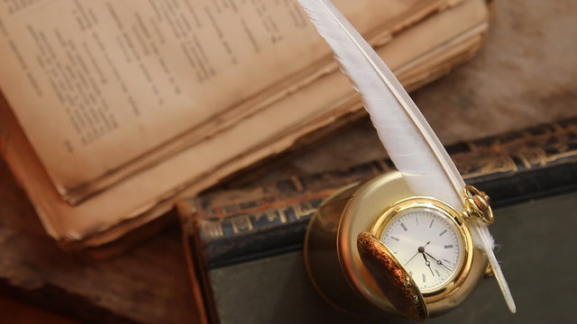 education idea, inscription on the label "education", gold pocket watch and textbook