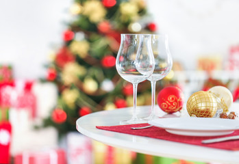 holiday table glasses of champagne on the background of Christmas tree